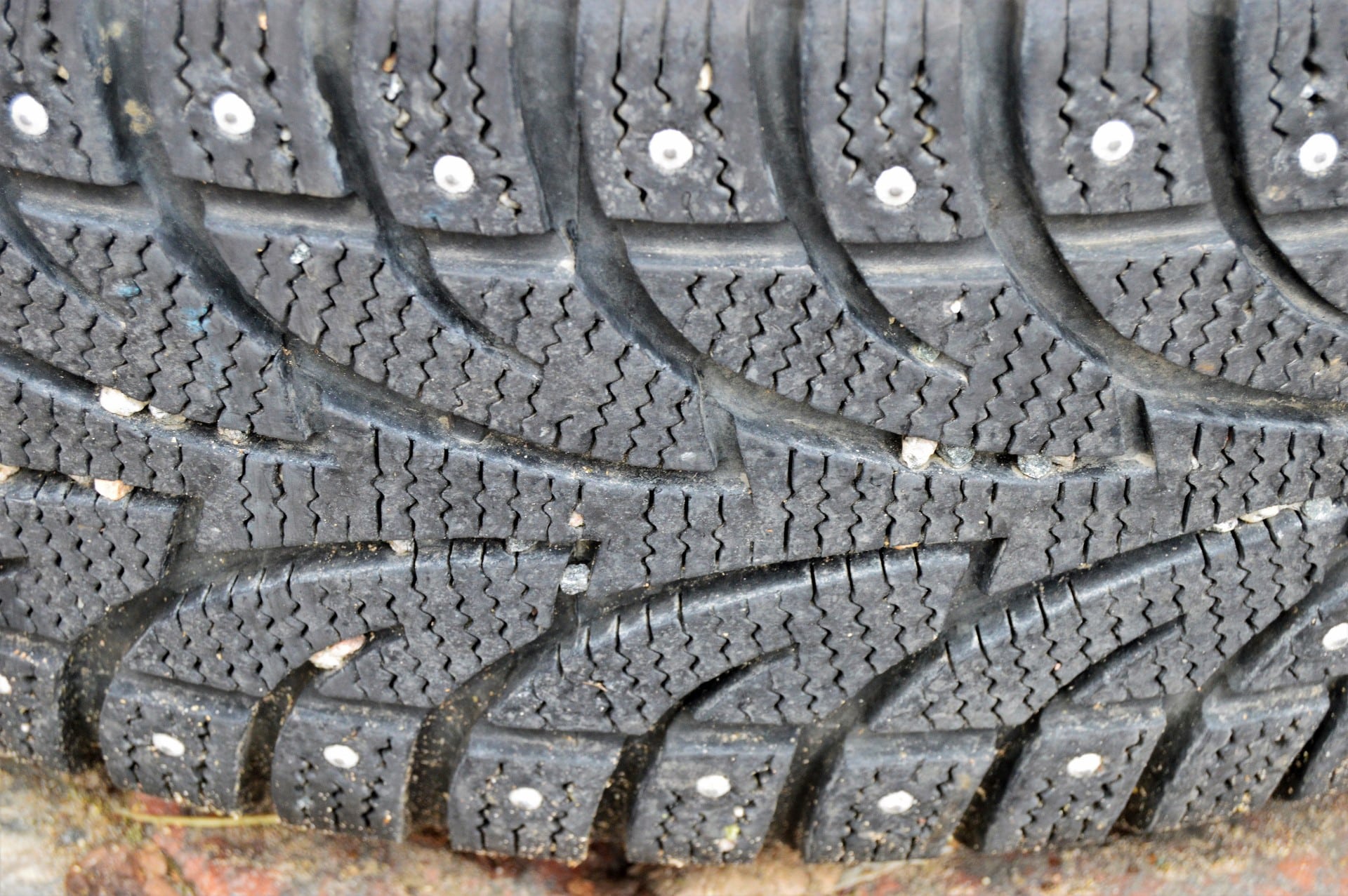 A studded snow tire with studs made of metal